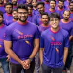 Zepto delivery executive carrying grocery orders for ultra-fast 10-minute delivery in India.