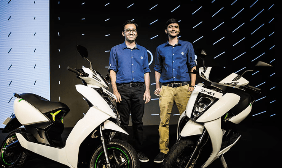 Tarun Mehta and Swapnil Jain, founders of Ather Energy, with an Ather electric scooter showcasing India's homegrown electric mobility innovation